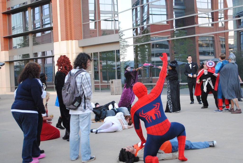 The TR Drama Club entertain students and trick-or-treaters with a scary skit with heroes overtaking evildoers on the patio area outside TRTR Main Street. 
Photos by Jayci Gillie/The Collegian