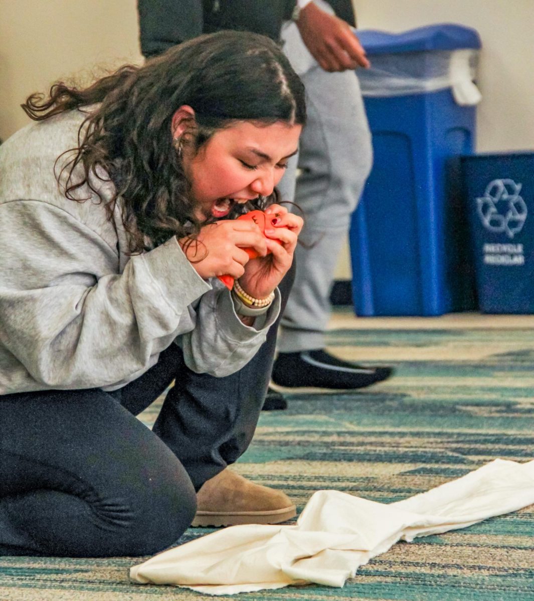 NW student Alma Dominguez playing Puss in “Puss In Boots” practices her facial expressions and movements to perfect the comedic engagement of her scenes.