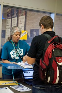 NW instructor Joan Shriver helps a student register for the annual Student Success Conference. Jayci Gillie/The Collegian