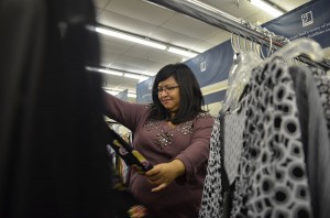 Dee Ramirez sorts through stylish blouses at the Goodwill Store in Hurst. A frequent thrift store shopper, she said the shirt she has on cost her only 25 cents at a resale shop in Fort Worth.Photos by Georgia Phillips/The Collegian 