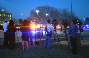 Media from around the area gather across the parking lot on SE Campus from the site of the shooting. Television helicopters hovered over the campus taking shots of the crime scene.  Photos by Georgia Phillips/The Collegian