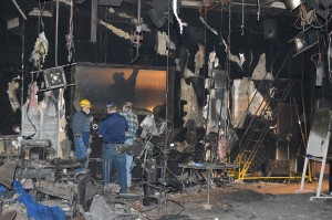 Workers sift through the destroyed NIMC building on NE Campus after a fire Dec. 8. The cause of the fire is still being investigated.  Photo courtesy Jerry Zumwalt