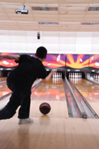 Kevin Bui bowls for his team at Showplace Lanes in the Feb. 5 NE intramural bowling event. Bui’s team won second place in the Scotch Doubles game. John Jones/The Collegian