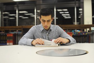 South student Javier Sicairos spends time on his math homework in the South library on a quiet evening after class.  Jayci Gillie/The Collegian