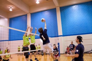 NE students play a game of volleyball in the gym. Men and women play intramural sports, but often, they play it separately.  Collegian file photo