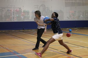 Jewel LeBlanc takes a long step forward preparing to throw her dodgeball during the NW charity game. 