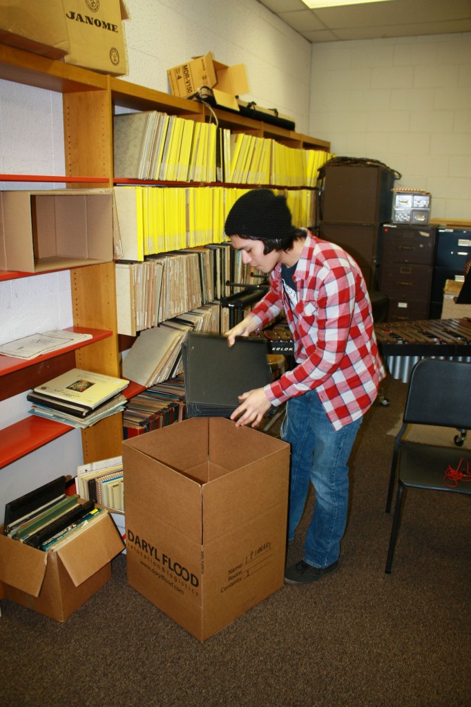 NE music major Alex Gillen packs up NE Campus’ vinyl collection in preparation for the renovation scheduled to begin March 6 and continue through early August. Photo by Carrie Duke/The Collegian