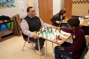 South Campus chess club member William Buggs plays a game with one of the students from Our Mother of Mercy Catholic School in Fort Worth April 2. Photo courtesy Natalie Johnson