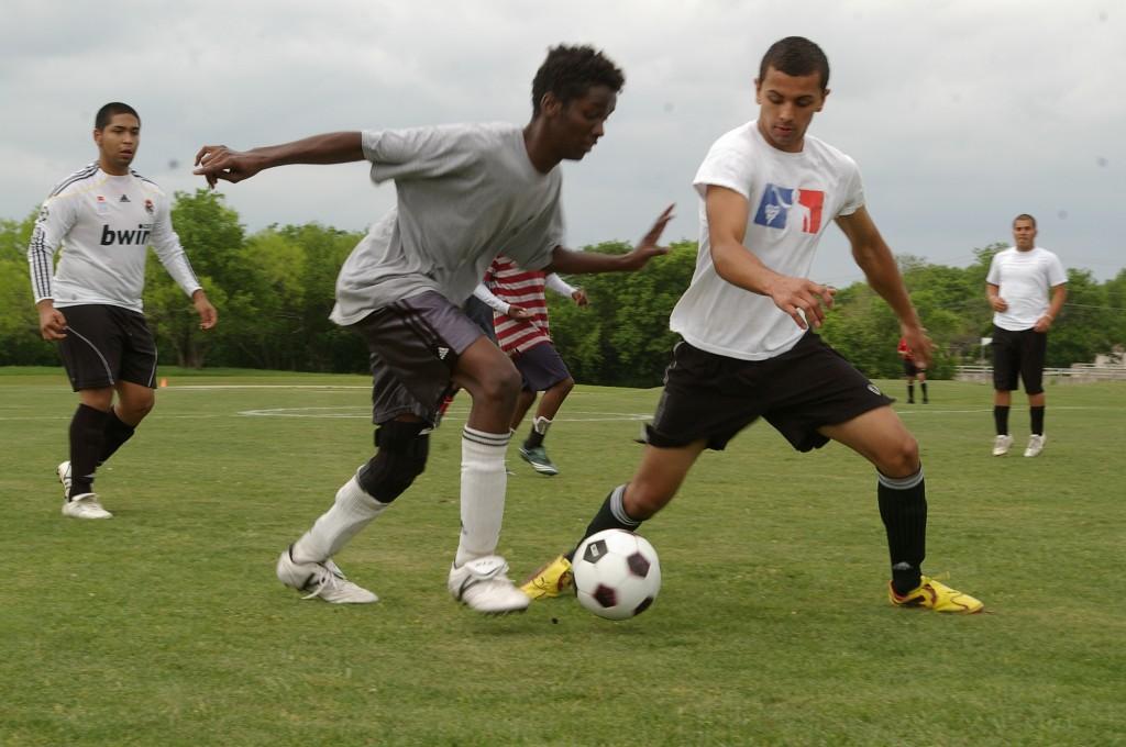 Abdikafav Mohamed and Frankie Jimenez race to the goal in a game between the Red Devils and DS during SE Campus intramural soccer play April 17. Photo by Mackenzie Ashton/The Collegian