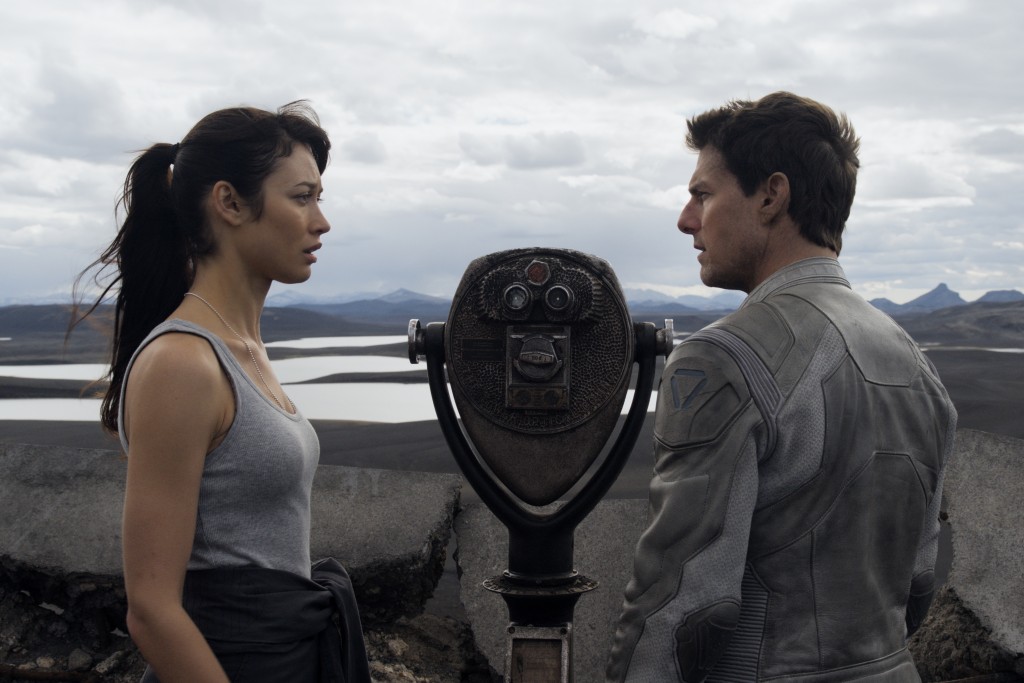 Julia (Olga Kurylenko) desperately attempts to bring forth the memories Jack (Tom Cruise) has of their relationship in what is left of the Empire State Building after alien invaders attack Earth in Oblivion. Photo courtesy Universal Pictures