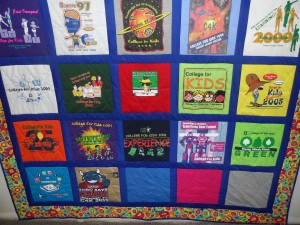 Using old T-shirts from the College for Kids programs dating back to the mid-’80s, NW Campus’ continuing education department created a quilt using techniques learned in the volunteer-taught class. Many senior students return in the summer to volunteer for the College for Kids program. Photo by Rhiannon Saegert/The Collegian