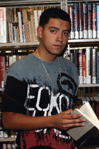 Angel Galarza, a South Campus Summer Bridge program student, uses the library’s resources. He passed his developmental courses and is now in college-level classes. Justin Gladney/The Collegian