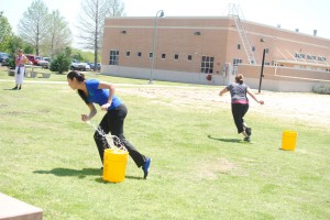 SE student Callen Omurwa darts across the field with a splash ball during the obstacle course April 12. Photot by Georgia Phillips/The Collegian
