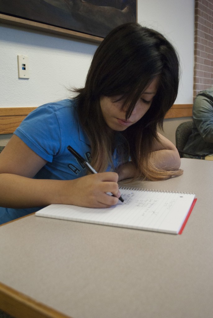Keren Valdez-Carmona, a SE Campus student, obtains income and knowledge by taking notes for students with disabilities. Photo by David Reid/The Collegian