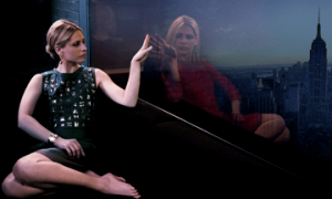 Sarah Michelle Gellar admires herself in a window. Gellar has taken the identity of her twin sister in Ringer.  Photo courtesy CW