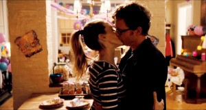 Kate and Richard Reddy (Sarah Jessica Parker and Greg Kinnear) share a kiss after realizing their lives will be thrown into a whirlwind in I Don’t Know How She Does It. Photo courtesy The Weinstein Company