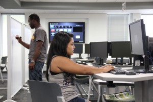 Math Emporium lets students learn at their own pace while working towards any degree. NW student Osuyi Uyinmwen, left, is currently enrolled in the aviation program and NW student Celeste Arreola, right, is studying criminal justice.  Photo by Zach Estrada/The Collegian