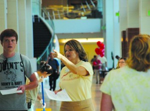 A Trinity River Campus representative assists a student in finding his classes on the first day of the fall semester Monday. The Trinity River Campus has roughly 3,500 students registered to attend the fall semester.  Photo by Brian Koenig/The Collegian