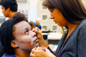 NE student Tyra Lampkin gets a zombie makeover from fellow student Heaven Roskilly during the class. Photo by Haylie Jones/The Collegian