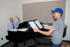 Student Josué Pérez practices his piece “Der vogelfanger bin ich ja” from the opera Manon with music instructor Stan Paschal in preparation for the Opera Club’s performances at 7:30 p.m. Oct. 12 and at 2 p.m. Oct. 13 in the NE Theatre.   Photo by Taurence Williams/The Collegian