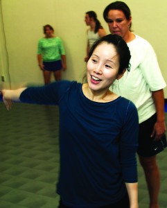 NE dance instructor Kihyoung Choi coaches student Gina Castellani on a routine in her modern dance class.  Photo by Casey Holder/The Collegian