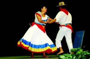 Two dancers twirl each other around the Center Corner stage in a traditional Colombian festivity as part of the Hispanic Heritage Month celebration on NE Campus last week.  Photo by Brian Koenig/The Collegian