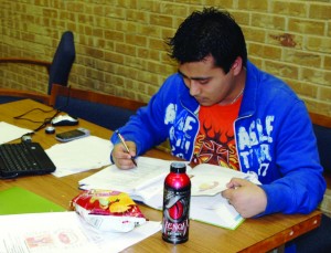 Aashish Ranjit studies for his Anatomy and Physiology II final exam in the NE Campus library.  Photo by Brian Koenig/The Collegian