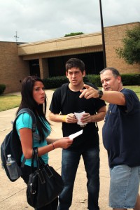 NE Campus students Macy Hickman and Jason Finley get directions from media staff member Ray Nelson the first day of classes.  Photo by Casey Holder/The Collegian