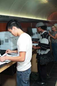 Student Thuan Tran finishes up with some last-minute registration issues at TR Campus.  Photo by Casey Holder/The Collegian