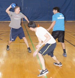 NE student Michael Logan takes the opportunity to hit Aamer Qureshi during the game. Students participated in several rounds of heroball Jan. 24. 