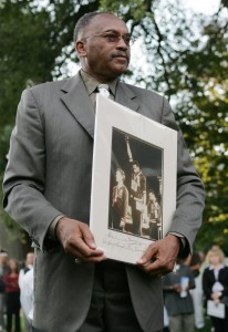 Jim Gensheimer/San Jose Mercury News/KRT  Tommie Smith, 1968 Olympic gold medal sprinter, holds the famous photo of himself during a statue unveiling in 2005.