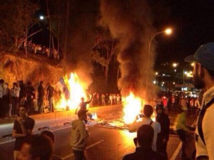 Photo courtesy Maria Artiles  Students protest in the streets of Tachira, Venezuela, where friends and family of South student Maria Artiles live. Protests turned violent after opposition leader Leopoldo Lopez turned himself in to authorities. 