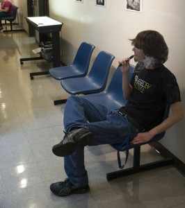 Jason Floyd/The Collegian  NE student Nick Rhoades smokes his electronic cigarette in a hallway. Currently, TCC policy only forbids tobacco use on campus, not electronic cigarettes. 