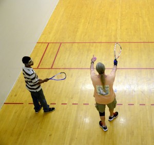 NE student Jino Thomas receives tips and instruction from experienced racquetball player  and fellow student Keith Abbott during a game March 28.