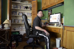 Georgia Phillips/The Collegian  NE student and founder of Beyond Eden Entertainment Matthew Whitaker works in the luxury of his own bedroom after starting his own video gaming business eight years ago.
