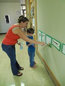 Cassandra Cosgrove and son Nick observe the caterpillar created as part of a class project about the life cycle of butterflies.  Photo by Victor Henderson/The Collegian