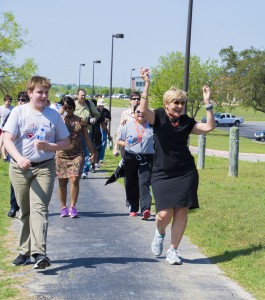 Students handed out water in between laps around the track, and walkers, including Mayor Price, danced to music. 