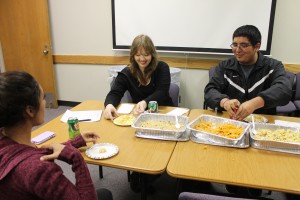 Haylie Jones/The Collegian  Students like Amber Chadwick and Eduardo Martinez participate in Conversations Across Countries on NW Campus. The group meets to discuss the different traditions of various cultures while sharing many types of food from different countries and help non-native speakers improve their English skills. 