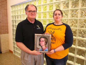 Photo courtesy Chuck and Sarah Hope  Chuck Hope, SE history professor, and Sarah Hope, English instructor, hold a portrait of his daughter Chappell Hope, who took her own life in 2010.