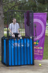 Photos by Jason Floyd/The Collegian  South student Dylan Luster waits to be dunked by participants throwing the ball toward the target at the Spring Fling.