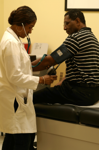 A TR Campus nurse takes learning center coordinator Steven LeMons’ blood pressure. Blood pressure checks are one of many services provided by campus health professionals. Collegian file photo.