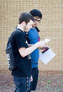 NE students Sunny Ali and Zach Rojas search for classes. Katelyn Townsend/The Collegian.