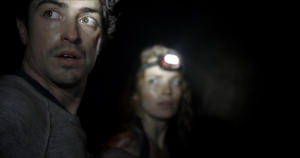 George (Ben Feldman) and Scarlett (Perdita Weeks) travel into the dark network of tunnels under the streets of Paris in the new horror film As Above, So Below, directed and written by John Erick Dowdle. Photo courtesy Legendary Pictures