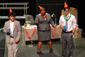 From left, Nolan Chapa as Dobbitt, Shae Morin as Merkin and Matt Dingler as Hanrahan act out at an office party during a rehearsal for Below the Belt on South Campus. 