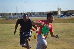 At left, Justin Rogers and Juan Juanes participate in South Campus’ flag football game between the Blazers and the Spartans. At right, a Spartans team member tries to escape from Juanes. The Blazers won 41-9 in the second day of South’s flag football season. Photos by Marah Irving/The Collegian