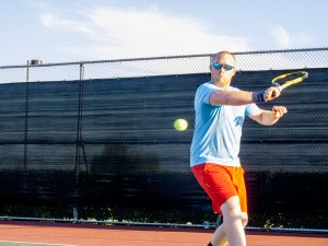 Bergen Hart swings to victory at the intramural tennis tournament on NW Campus Sept. 24. With his 23 years of experience, he won the tournament finale 6-0. Hope Sandusky/The Collegian