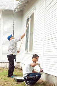 Elvis Martinez and Sudeep Shresda paint a home in the Northside area of Fort Worth Oct. 11. Photos by Audrey Werth/The Collegian
