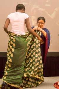 English professor Liz Joseph demonstrates how to wear a sari with student Ndey Secca. Along with the sari demonstration, there was also an African headscarf demonstration. Photos by Jamie Thatcher/The Collegian