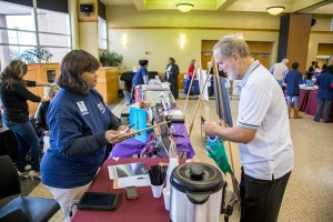 Senior student James Baker gathers information from various health and volunteer service vendors at the SE Senior Citizen Expo Nov. 13. Eric Rebosio/The Collegian