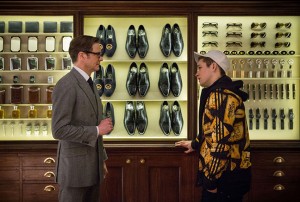 Colin Firth shows Taron Egerton the special gadgets the Secret Service has access to use on special missions during the film Kingsman: The Secret Service. Courtesy 20th Century Fox